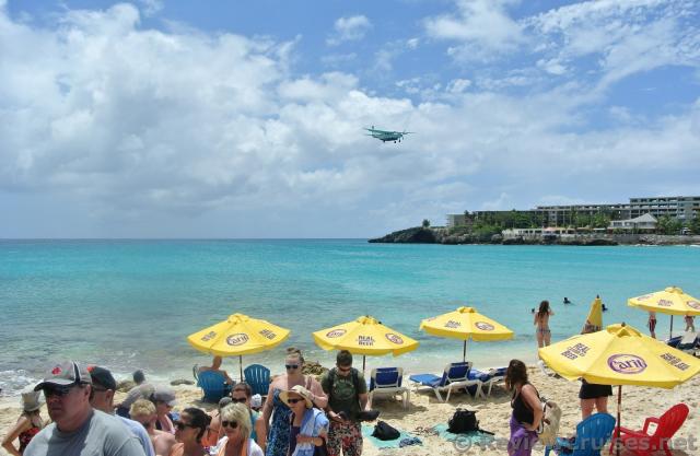 Small aircraft approaching over Maho to land at St Martin Airport.jpg