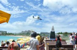 Wixair PJ-WIJ Plane flying over Maho Beach.jpg