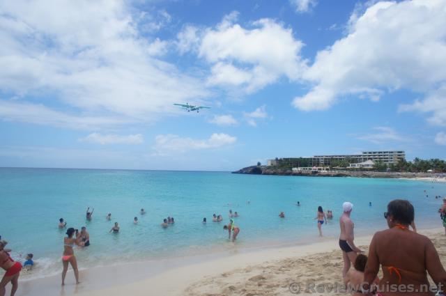 Twin Propeller Airplane flying over waters of Maho Beach.jpg
