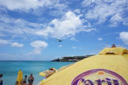 Single Propeller airplane about to land at Princess Juliana International Airport crossing Maho Beach.jpg