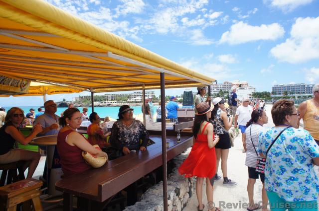 Crowd at Sunset Grill look towards the Princess Juliana International Airport.jpg