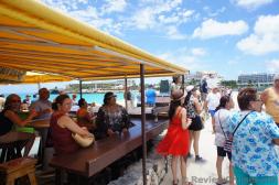 Crowd at Sunset Grill look towards the Princess Juliana International Airport.jpg