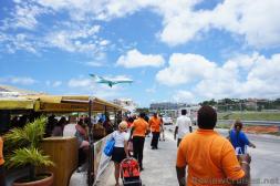 Small Airplane about to land at Princess Juliana International Airport.jpg