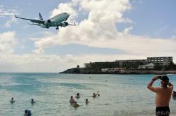 Twin Engine WestJet Airplane flying over Maho Beach.jpg