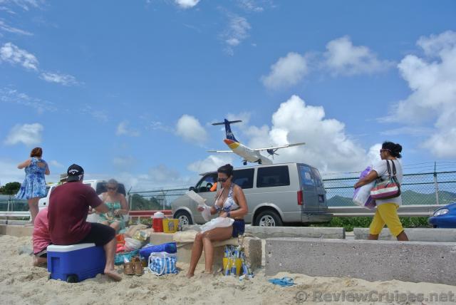 Typical Beach Scene at Maho with airplane overhead and landing.jpg