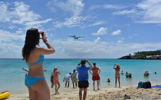 Twin Propeller Airplane arriving over Maho Beach.jpg