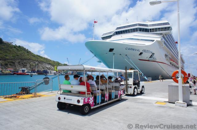 Tram escorting passengers from front of pier to cruise ships in St Martin.jpg
