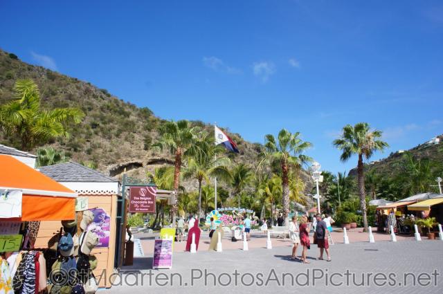 St Maarten flag and palm trees at St Maarten cruise terminal area.jpg
