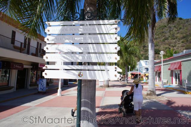 Direction signs in St Maarten cruise terminal plaza.jpg
