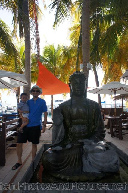 Darwin and daddy next to Buddha statue in Philipsburg St Maarten.jpg