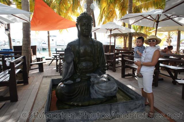 Darwin and Mommy next to Buddha statue in Philipsburg St Maarten.jpg
