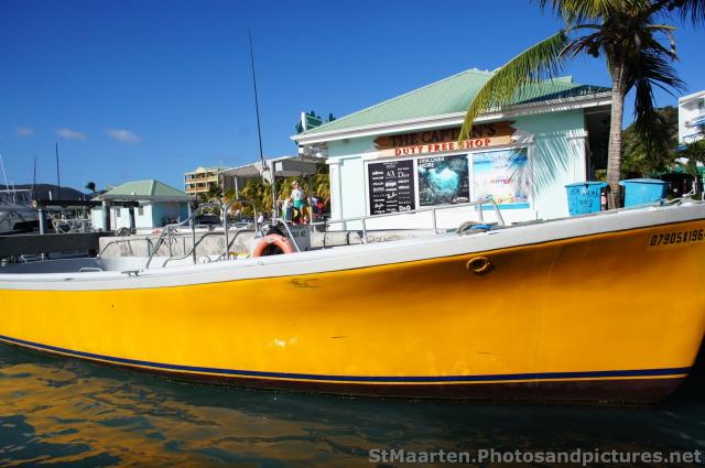 Yellow boat docked at Philipsburg St Maarten.jpg

