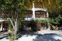 Beach-side hotel with palm trees and oleanders in Philipsburg St Maarten.jpg