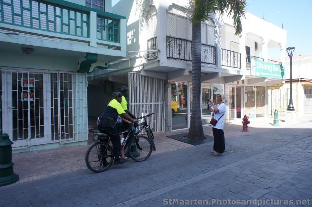 Tourist taking photo of Philipsburg St Maarten Police on bicycles.jpg