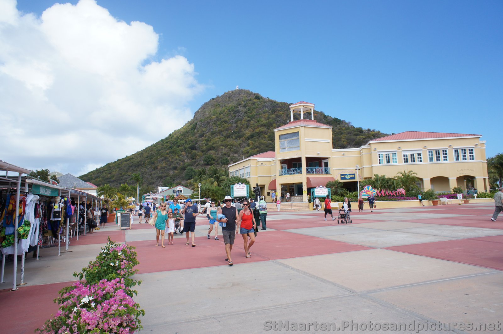 Tourists walk around the St Maarten cruise center.jpg
